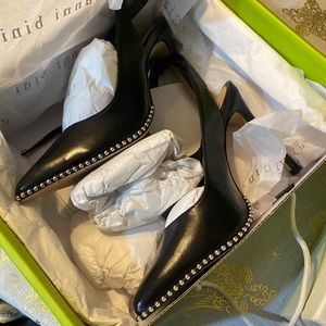 black heels with metallic balls on the bottom